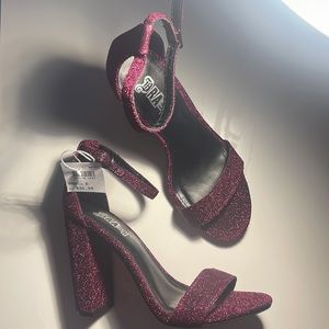 Brash women heels size 6. It’s a purple with glitter heels.Brand New